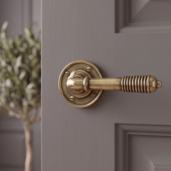 The "Balcroft" Antique Brass Beehive Lever Handles on a Grey Door in a Modern Home - Digital Illustration The "Balcroft" Antique Brass Beehive Lever Handles on a Grey Door in a Modern Home - Digital Illustration