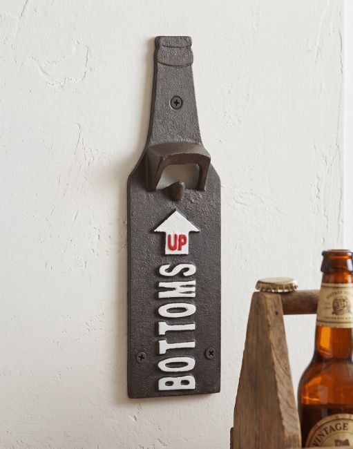 The "Bottoms Up" Wall Bottle Opener on a White Painted wall next to a Bottle of Beer - Digital Illustration