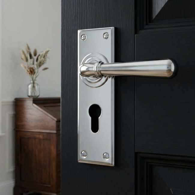 The "Emerson" Bright Chrome Euro Lever Door Handle in a Period Home on a Black Door - Digital Illustration