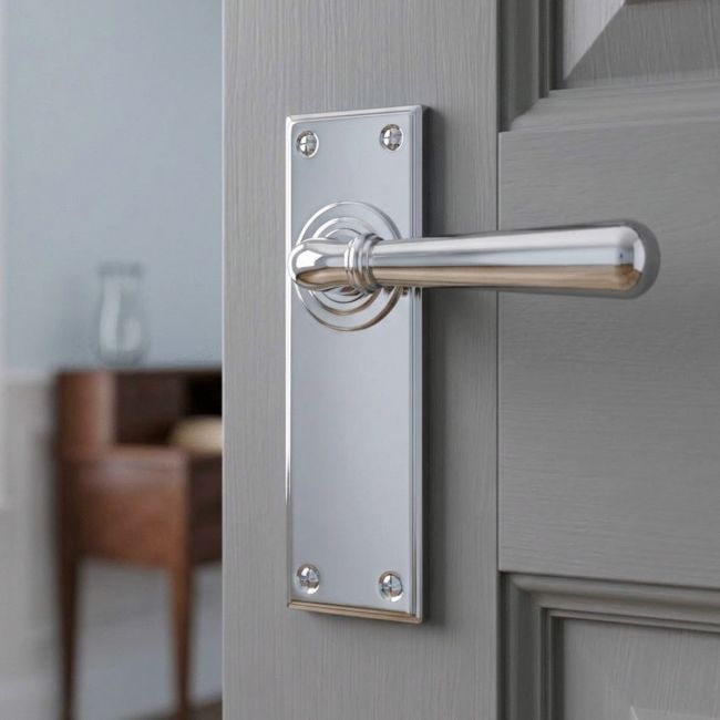 The "Emerson" Bright Chrome Traditional Lever Door Handles on a Light Grey Coloured Door in a Modern Home - Digital Illustration
