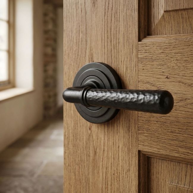 Black Hammered Lever Door Handle on Art Deco Rose Black Hammered Lever Door Handle on Art Deco Rose