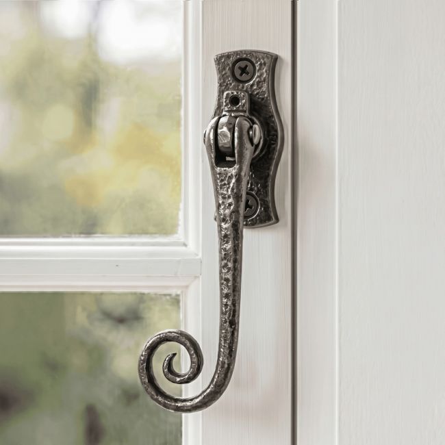 The "Hallstable Park" Monkeytail Iron Window Fastener on a Traditional White Window Frame - Digital Illustration 