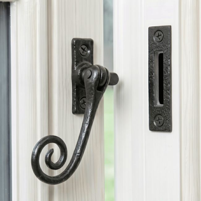 The "Harebank" Locking Casement Stay Fitted on a Handpainted White Window Frame - Digital Illustration