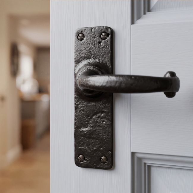 The "Helmsdrock Foundry" Simple Black Cast Iron Door Handles on a Light Grey Door in Modern Home - Digital Illustration