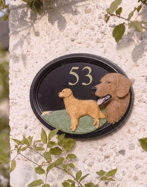 A Number 53 "Lincoln" Hand Painted Golden Retreiver House Number Sign Mounted on a Cream Coloured Cottage Wall - Digital Illustration A Number 53 "Lincoln" Hand Painted Golden Retreiver House Number Sign Mounted on a Cream Coloured Cottage Wall - Digital Illustration