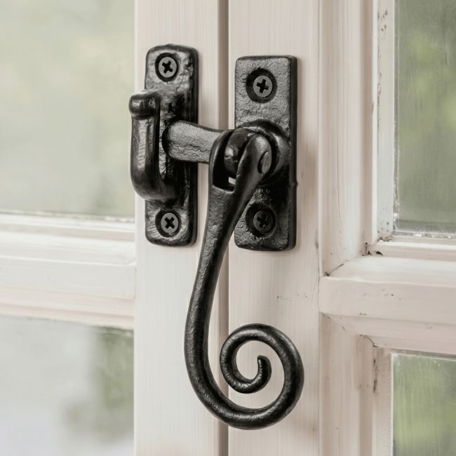 The "Netherby" Monkey Tail Casement Stay Fitted on a Handpainted White Window Frame - Digital Illustration The "Netherby" Monkey Tail Casement Stay Fitted on a Handpainted White Window Frame - Digital Illustration