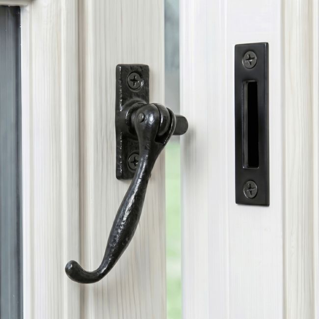 The "Ollerton Avenue" Contemporary Iron Casement Stay Mounted on a Traditional White Wooden Windowframe - Digital Illustration The "Ollerton Avenue" Contemporary Iron Casement Stay Mounted on a Traditional White Wooden Windowframe - Digital Illustration