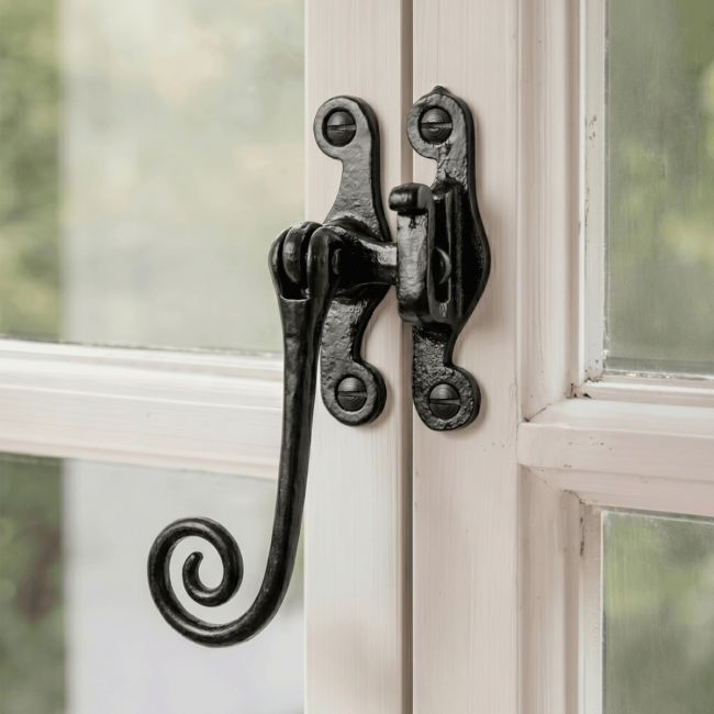 The "Padmoore" Iron Casement Stay Fitted on a Classic White Wooden Window Frame - Digital Illustration The "Padmoore" Iron Casement Stay Fitted on a Classic White Wooden Window Frame - Digital Illustration
