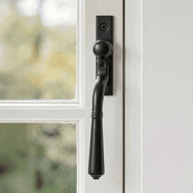 The "Regency" Teardrop Espagnolette Window Fastener Fitted on a Classic White Window Frame in a Country Home - Digital Illustration