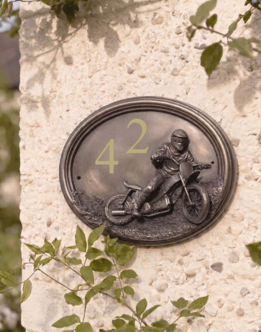 A Number 42 "Speedway" Off Road Motocross House Sign Mounted on a Cream Coloured Cottage Garden Wall - Digital Illustration
