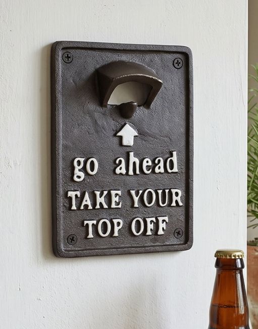 The "Take Your Top Off" Cast Iron Bottle Opener on a White Wall next to a Beer Bottle - Digital Illustration
