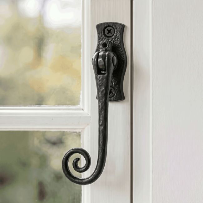 The "Wrestford Hall" Black Monkeytail Iron Window Fastener Mounted on a Traditional White Window Frame - Digital Illustration