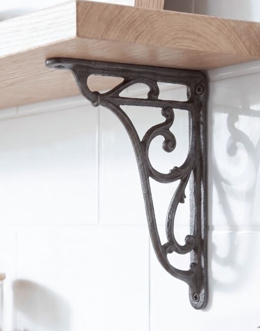 The 24 x 16cm Cast Iron Heritage Wall Bracket Fixed on a White Kitchen Tile Wall for a Wooden Shelf - Digital Illustration 