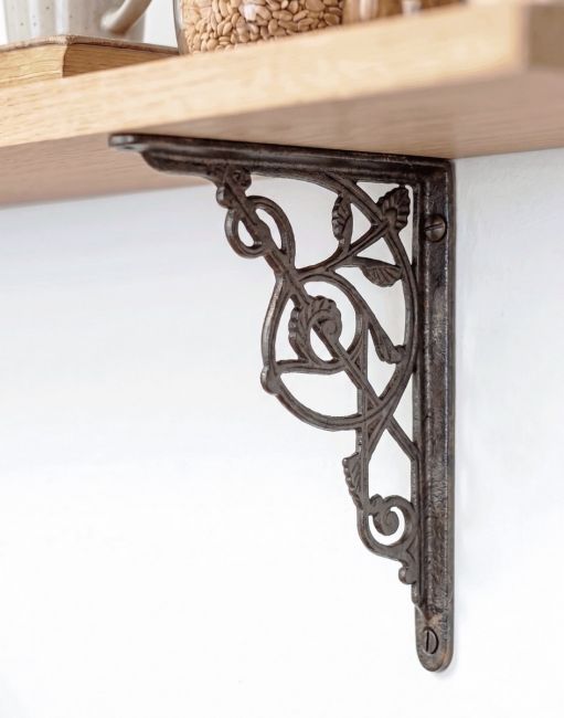 The 24 x 19cm Trellis Iron Shelf Bracket Being Used on DIY Shelving in a Modern Home - Digital Illustration
