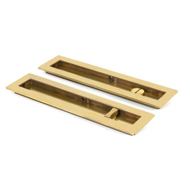 The 250mm Classic Rectangular Sliding Pocket Door Privacy Set in Aged Brass Showing the Front and Back Section from an Angle