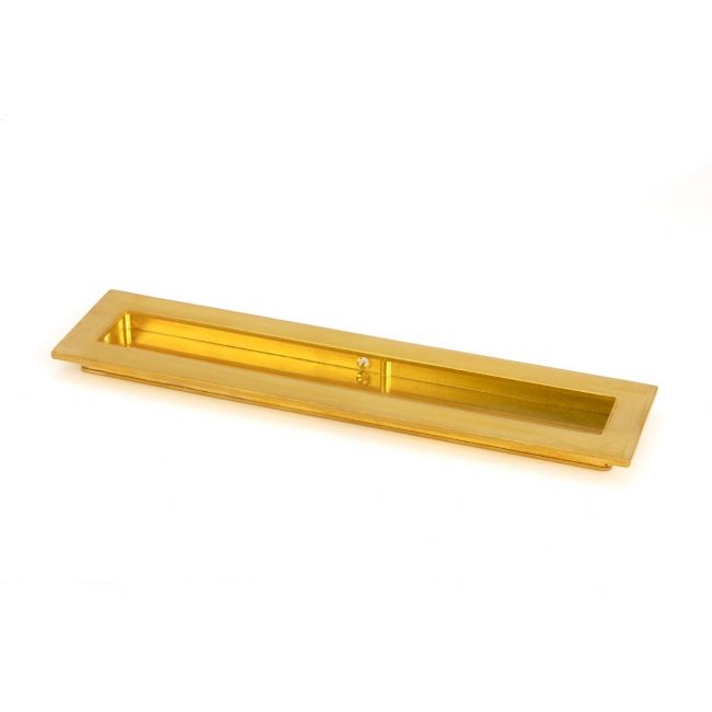 The 250mm Plain Rectangular Flush Pull Handle in Polished Brass Shown on its Side on a White Background