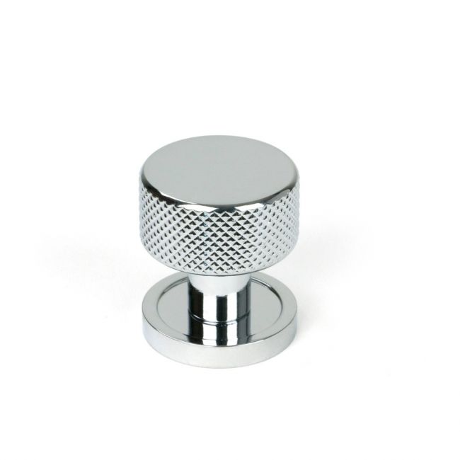 The 25mm Knurled Cabinet Knob on a Plain Rose in Polished Chrome Shown Upright on a White Background The 25mm Knurled Cabinet Knob on a Plain Rose in Polished Chrome Shown Upright on a White Background