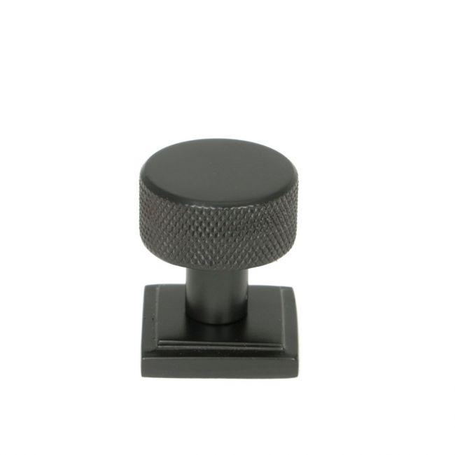 The 25mm Knurled Cabinet Knob on a Square Rose in Aged Bronze Shown Upright on a White Background 