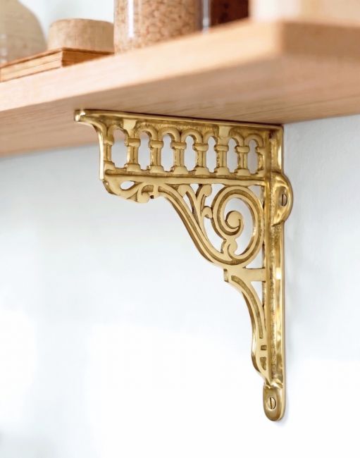 The 26 x 21cm Classic Railway “Ribbleshead” Brass Shelf Bracket Mounted of a White Coloured Contemporary Living Room Wall - Digital Illustration