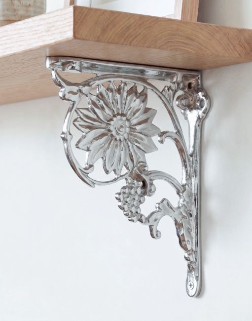 The 27 x 21cm Bright Chrome Sunflower Shelf Bracket Mounted on a Modern Interior home Wall - Digital Illustration