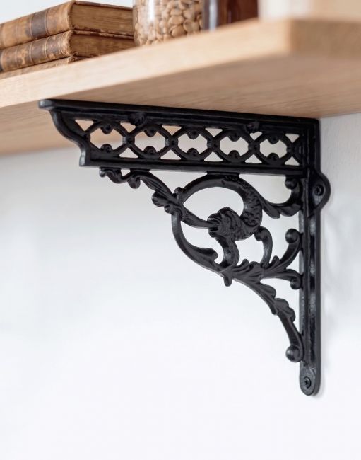 The 29cm x 33cm Serpent Iron Shelf Bracket Mounted on a Cream Coloured Modern Kitchen Wall - Digital Illustration 
