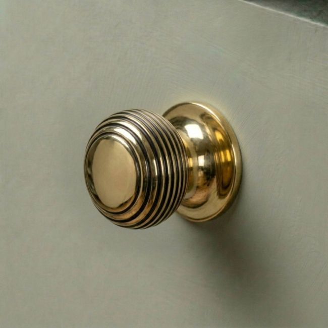The 30mm Individual Aged Brass Beehive Cabinet Knob Fitted on a DIY Kitchen Cupboard in a Contemporary Home - Digital Illustration The 30mm Individual Aged Brass Beehive Cabinet Knob Fitted on a DIY Kitchen Cupboard in a Contemporary Home - Digital Illustration