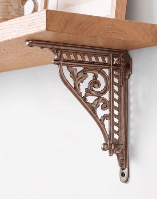 The 31 x 26cm Natural Iron Cast Iron Shelf Bracket Mounted on a Cream Coloured Living Room Wall - Digital Illustration 