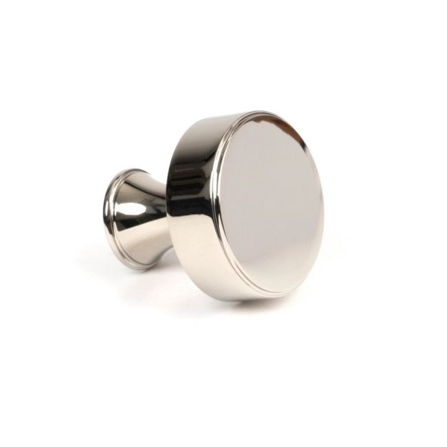 The 32mm "Atelier" Circular Cabinet Knob in Polished Nickel on a White Background Shown from Side on