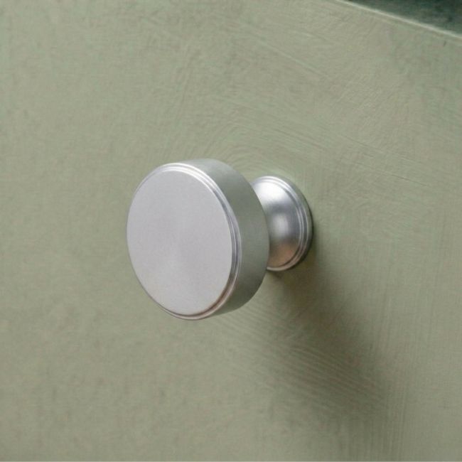 The 32mm "Atelier" Circular Cabinet Knob in Satin Chrome on a White Background Shown Side on
