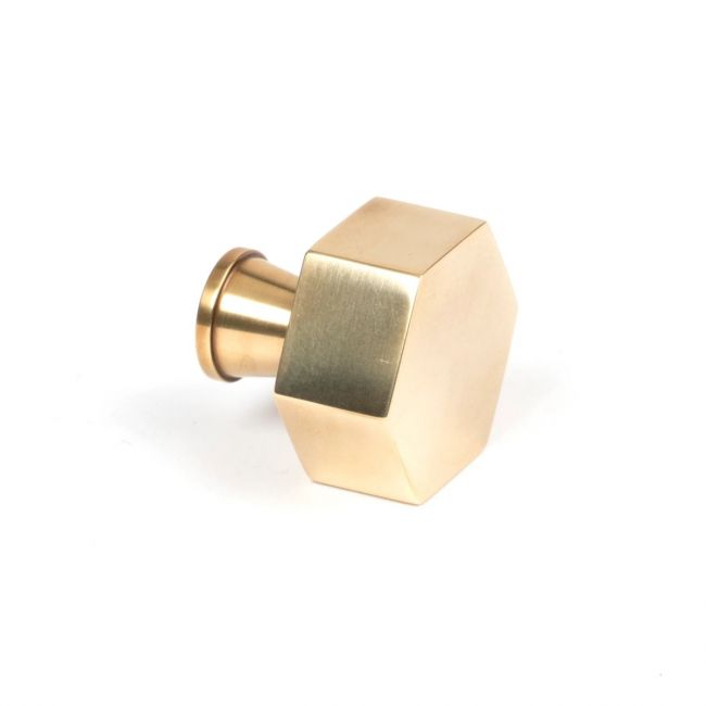 The 32mm "Vanguard" Hexagonal Cabinet Knob in Aged Brass on a White Background Shown from the Side
