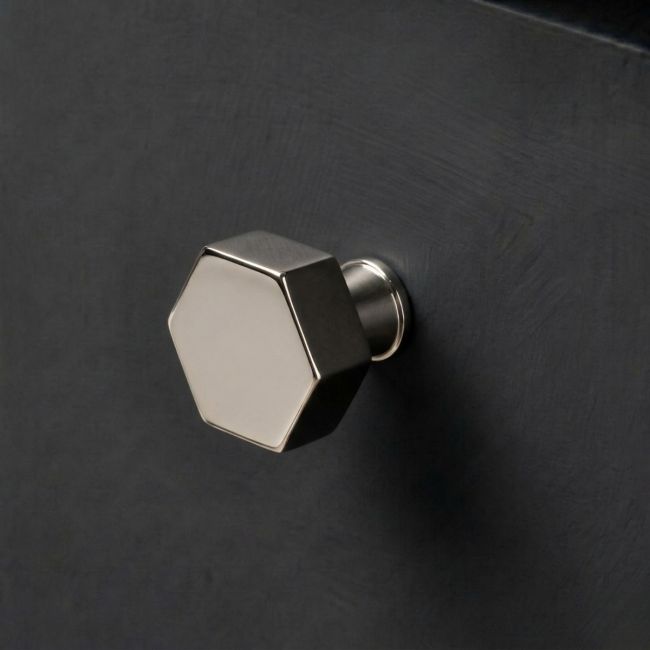 The 32mm "Vanguard" Hexagonal Cabinet Knob in Polished Nickel Mounted on a Charcoal Coloured Kitchen Drawer - Digital Illustration The 32mm "Vanguard" Hexagonal Cabinet Knob in Polished Nickel Mounted on a Charcoal Coloured Kitchen Drawer - Digital Illustration