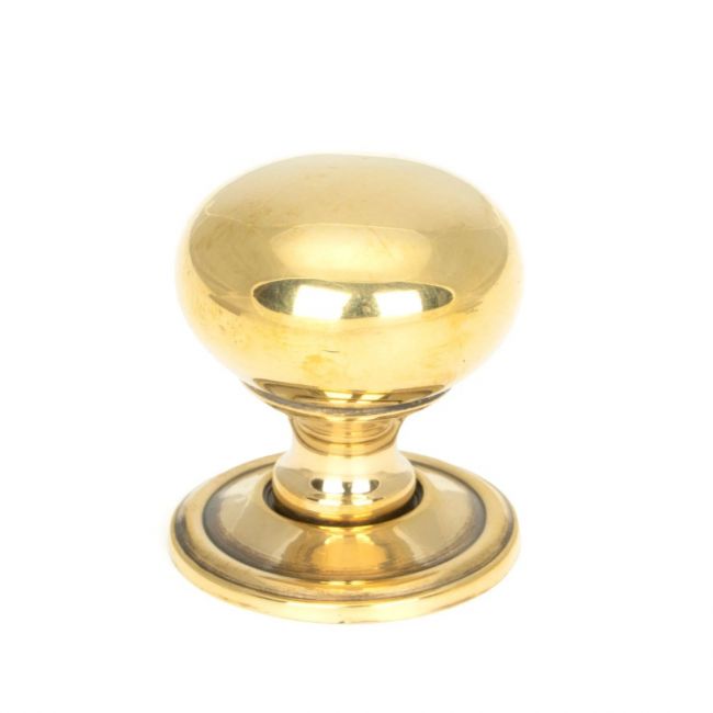 The 32mm Aged Brass Classic Mushroom Cabinet Knob on a White Background Shown Upright The 32mm Aged Brass Classic Mushroom Cabinet Knob on a White Background Shown Upright
