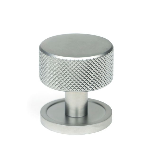The 32mm Knurled Cabinet Knob on a Plain Rose in Satin Chrome Shown Upright on a White Background