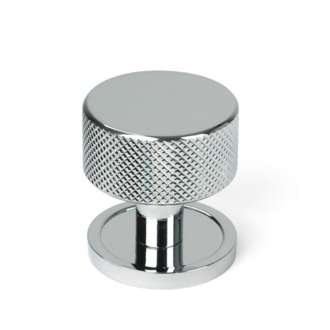 The 32mm Knurled Cabinet Knob on Plain Rose in Polished Chrome Shown Upright on a White Background The 32mm Knurled Cabinet Knob on Plain Rose in Polished Chrome Shown Upright on a White Background