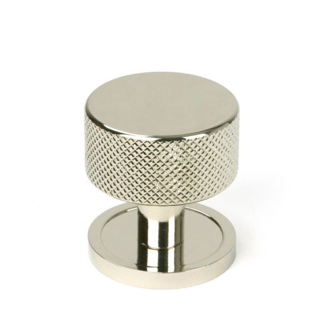 The 32mm Knurled Cabinet Knob on Plain Rose in Polished Nickel Shown Upright on a White Background