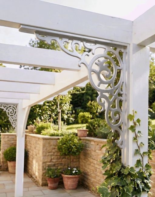 The 38 x 33cm Fretted Ivy Conservatory Bracket Pictured in an Ornate Sunny British Garden - Digital Illustration
