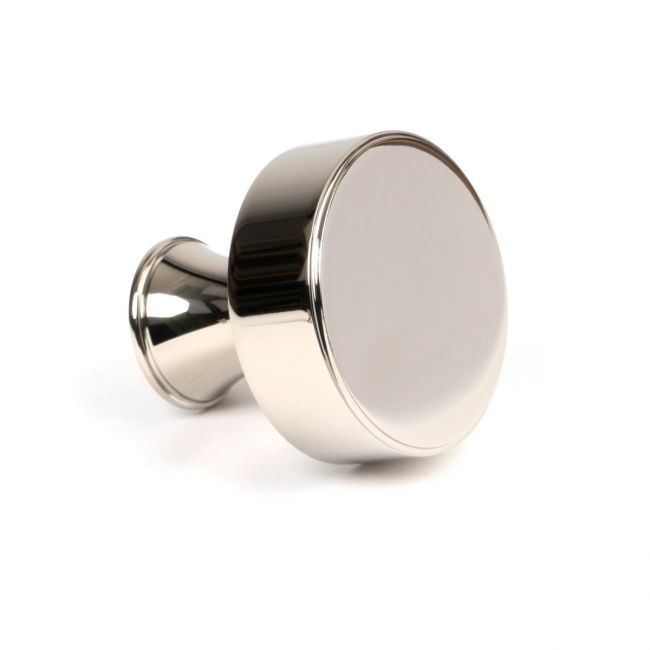 The 38mm "Atelier" Circular Cabinet Knob in Polished Nickel on a White Background Shown Side on