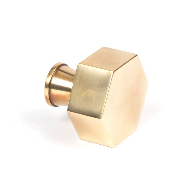 The 38mm "Vanguard" Hexagonal Cabinet Knob in Aged Brass on a White Background Viewed Side on