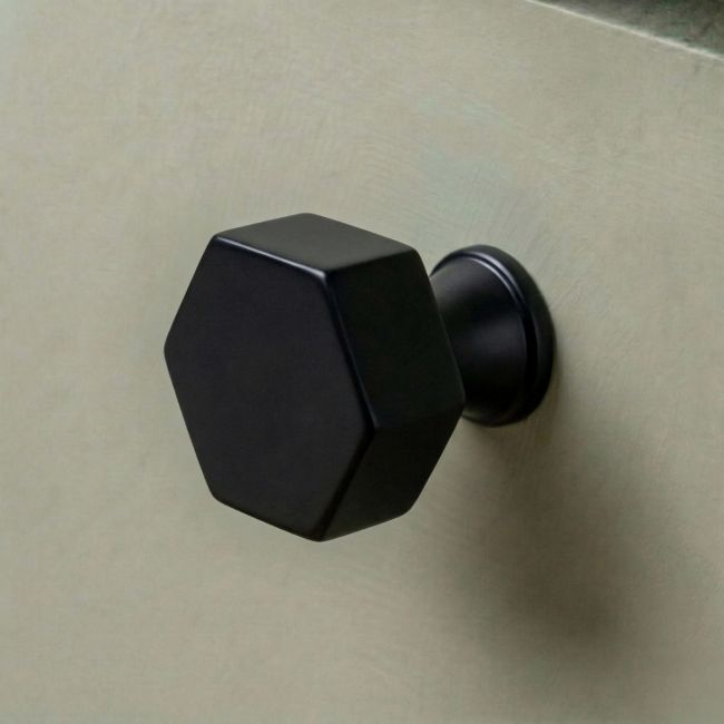 The 38mm "Vanguard" Hexagonal Cabinet Knob in Matt Black Mounted on a Kitchen Cupboard Drawer - Digital Illustration The 38mm "Vanguard" Hexagonal Cabinet Knob in Matt Black Mounted on a Kitchen Cupboard Drawer - Digital Illustration