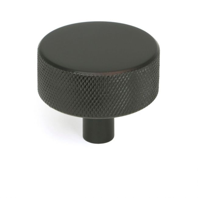 The 38mm Knurled Cabinet Knob (No Rose) in Aged Bronze Shown Upright on a White Background