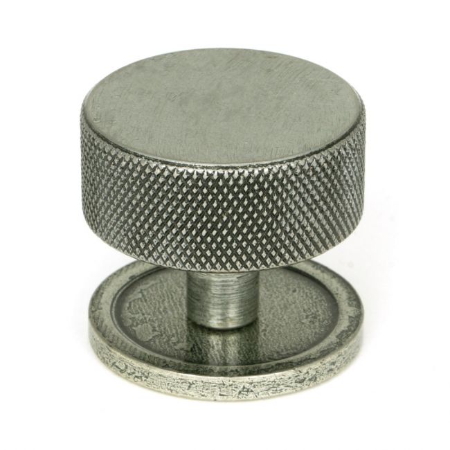 The 38mm Knurled Cabinet Knob on a Plain Rose in Pewter Shown Upright on a White Background