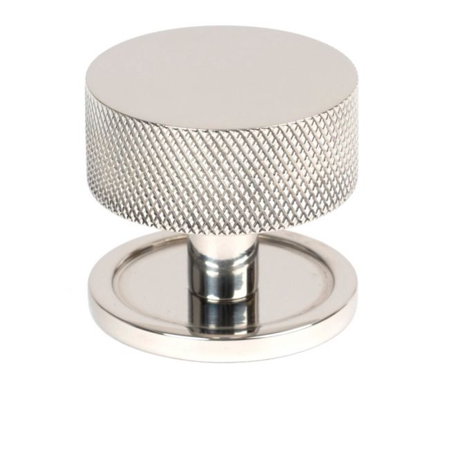The 38mm Knurled Cabinet Knob on a Plain Rose in Polished Stainless Steel Shown Upright on a White Background