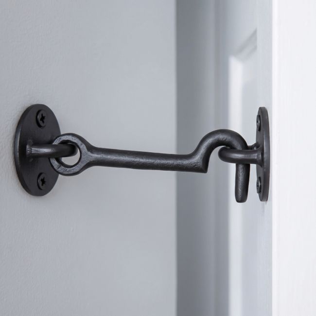The 3" Simplistic Iron Cabin Hook Mounted on a Door in a Modern Home - Digital Illustration 