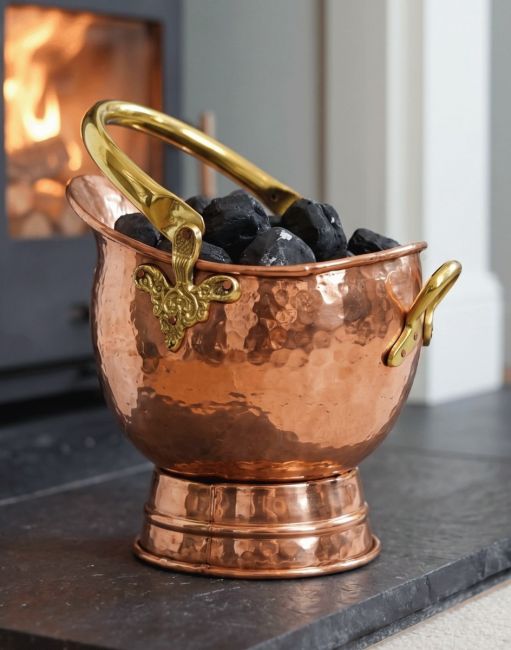 The 41cm"Windsor" Coal Bucket in a Copper Effect Finish Displayed on a Black Stone Fireplace - Digital Illustration The 41cm"Windsor" Coal Bucket in a Copper Effect Finish Displayed on a Black Stone Fireplace - Digital Illustration