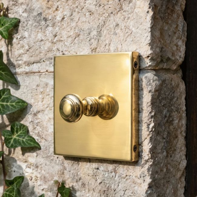 The 4x4 Square bell push- Brass on a Grey Stone Wall by a Front Door - Digital Illustration The 4x4 Square bell push- Brass on a Grey Stone Wall by a Front Door - Digital Illustration