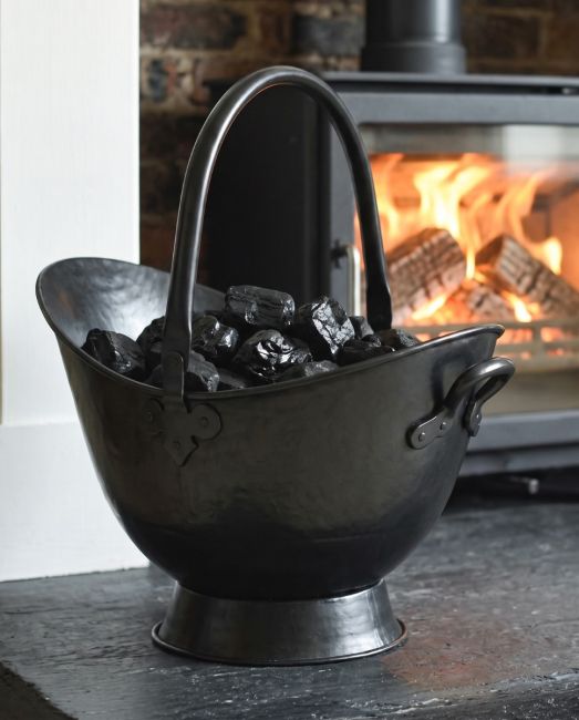 The 53cm "Waterloo" Black Iron Coal Bucket Placed in a Contemporary Living Room with a Log Burner Behind - Digital Illustration The 53cm "Waterloo" Black Iron Coal Bucket Placed in a Contemporary Living Room with a Log Burner Behind - Digital Illustration