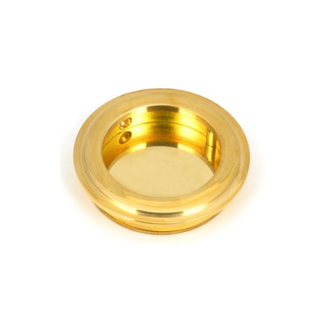 The 60mm Art Deco Round Flush Pull Handle in Polished Brass shown up close on a White Background