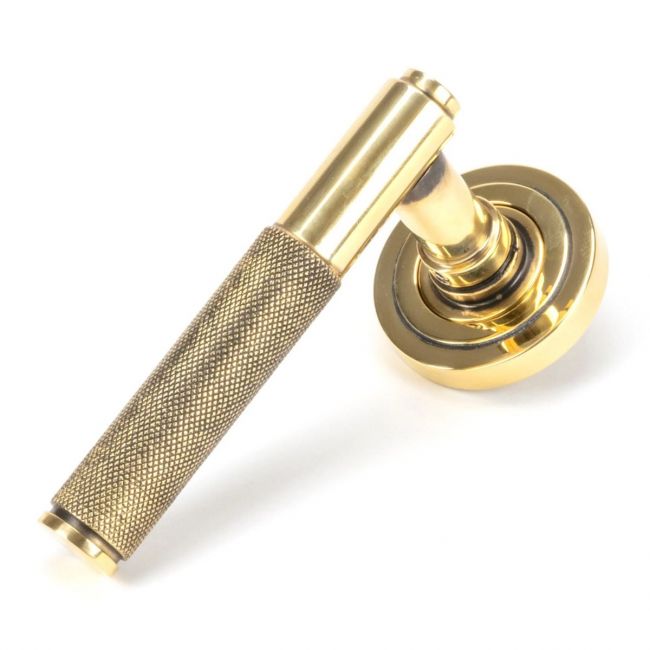 The Aged Brass Knurled Lever on Art Deco Rose Set on a White Background The Aged Brass Knurled Lever on Art Deco Rose Set on a White Background