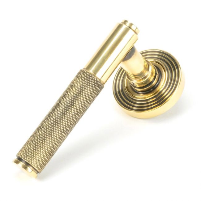 The Aged Brass Knurled Lever on Beehive Rose Set on a White Background The Aged Brass Knurled Lever on Beehive Rose Set on a White Background
