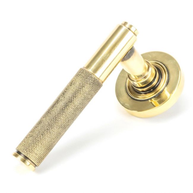 The Aged Brass Knurled Lever on Plain Rose Set on a White Background The Aged Brass Knurled Lever on Plain Rose Set on a White Background